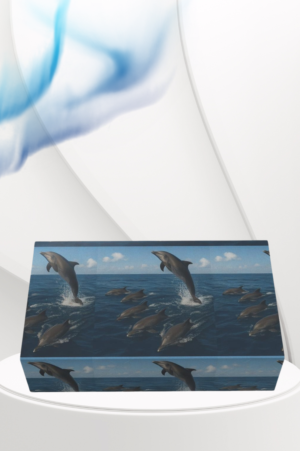 Wooden box with dolphin design on a white surface