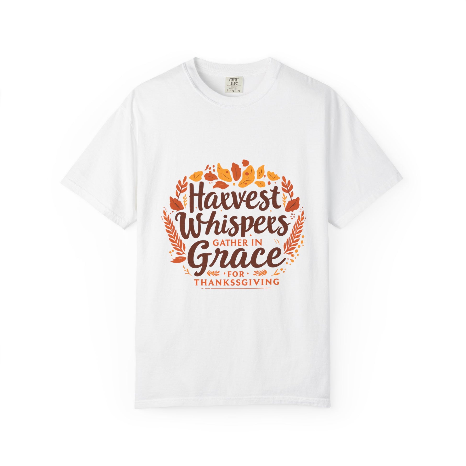 White t-shirt with 'Harvest Whispers Gather in Grace for Thanksgiving' text and leaf design on a white background