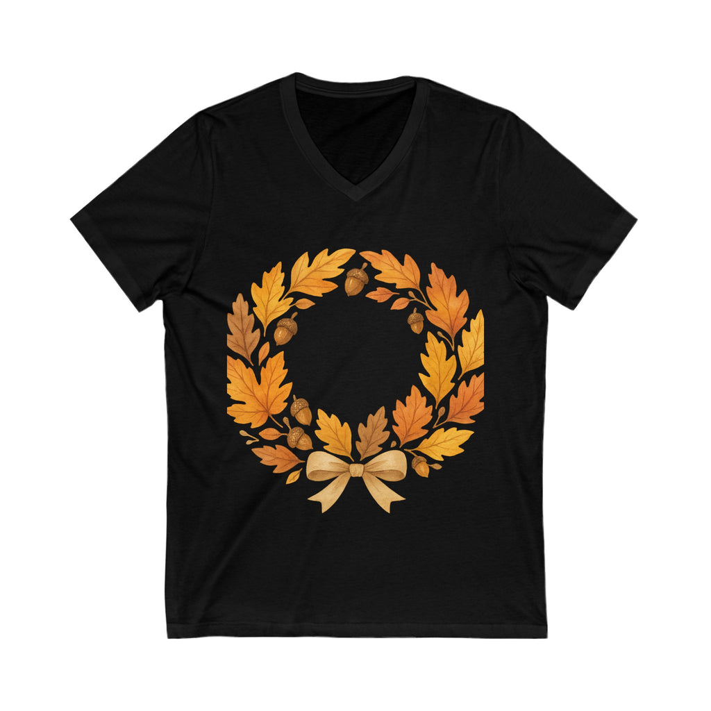 Black t-shirt with a wreath of autumn leaves and a bow on a white background